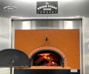 a photo of the oven mounted on the trailer for Lem's Bigwood Pizza
