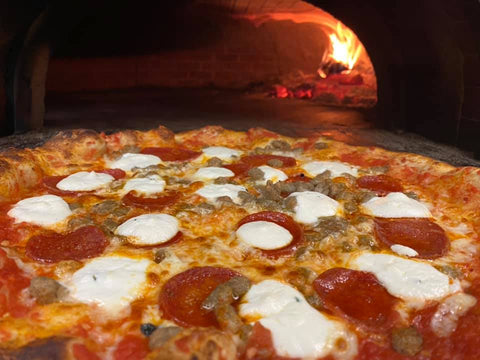 Revival Pizza Co. hot and ready pizza in wood fired oven