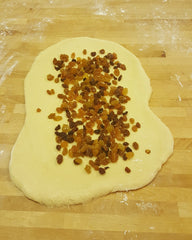 unbaked challah dough with raisins