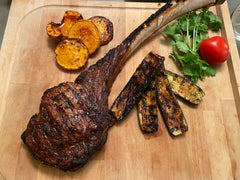 Grilled Beef Tomahawk On Cutting Board