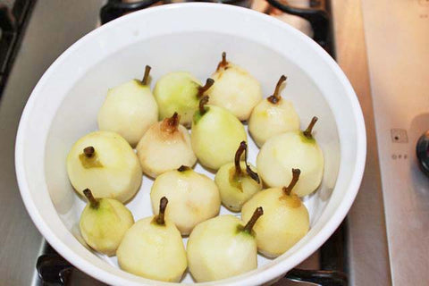 Peeled Seckel Pears in a Baking Dish