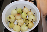 Peeled Seckel Pears in baking dish