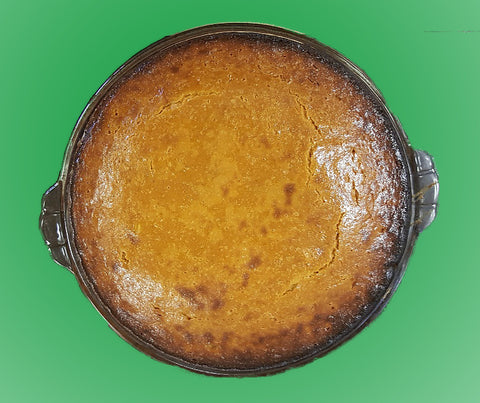 baked pumpkin pie green background