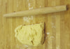 brioche dough and rolling pin