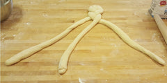 challah dough being braided