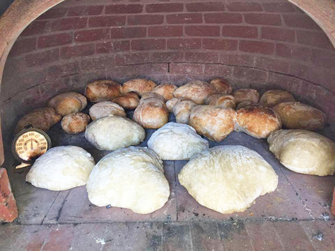 Baking bread in a wood fired brick oven