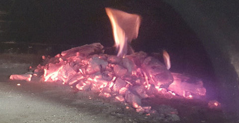 embers and flame in wood fired oven