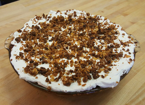 pumpkin pie with maple whipped cream and cinnamon crunch topping