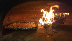 granola baking in a wood fired oven