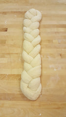unbaked braided challah loaf