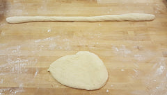 unbaked challah dough being shaped